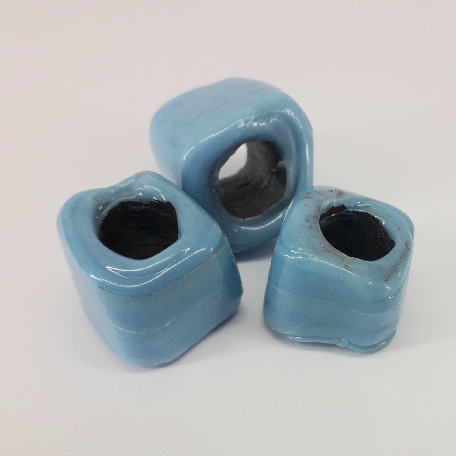 a couple of cups that are on a table 