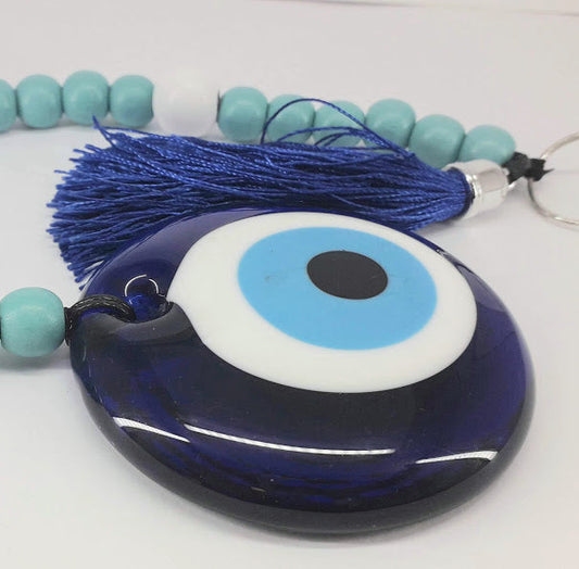 a blue cake is on a plate on a table 